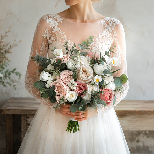 Dusty pink silk wedding bouquet with blush roses, ivory blooms and greenery