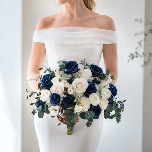 Navy blue and white silk wedding bouquet with ivory roses and eucalyptus greenery