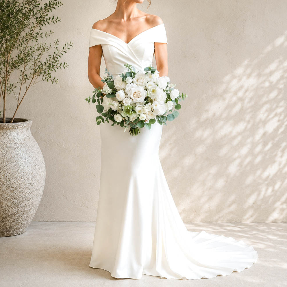 White and sage silk wedding bouquet with ivory roses, white blooms and eucalyptus greenery