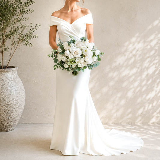 White and sage silk wedding bouquet with ivory roses, white blooms and eucalyptus greenery