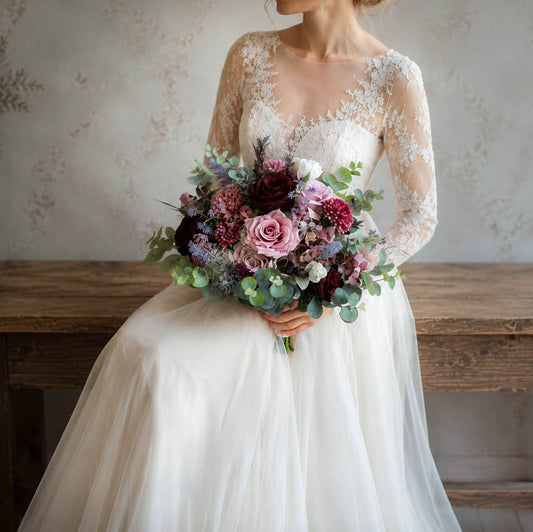 Mauve and burgundy silk wedding bouquet with dusty rose blooms and greenery